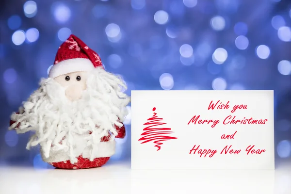 Santa Claus with Christmas greeting card — Stock Photo, Image