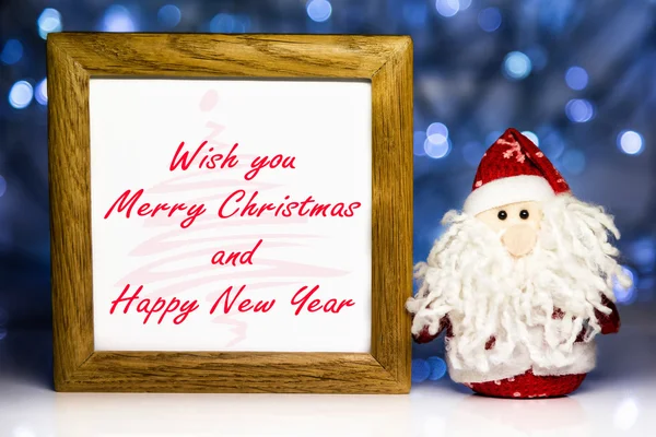 Santa Claus and greeting wooden frame — Stock Photo, Image