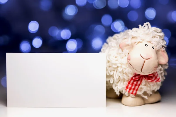 Sheep with blank card — Stock Photo, Image