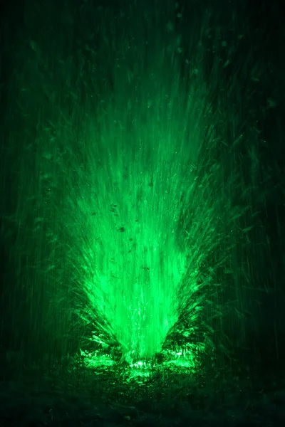 Colorful fountain splashes light green color — Stock Photo, Image