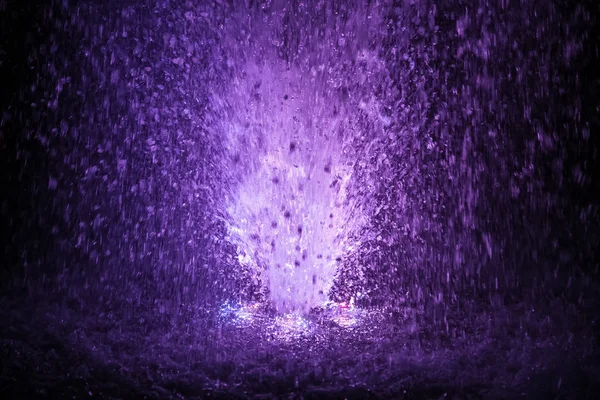 Colorful fountain splashes violet and white color — Stock Photo, Image