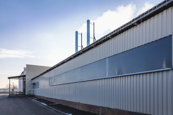 Wall of industrial building with pipes — Stock Photo, Image