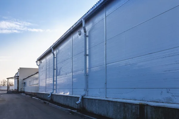 Wall of industrial building with pipes — Stock Photo, Image