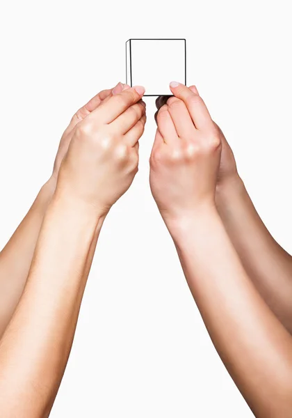 Руки, що тримають білий куб — стокове фото