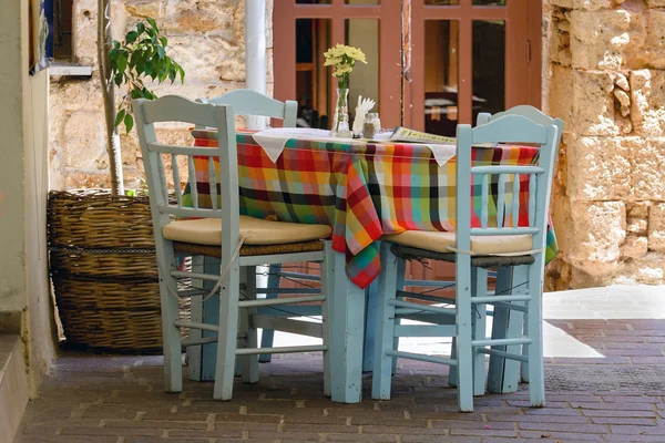 Traditional Greek table at cafe on Crete island — Stock Photo, Image