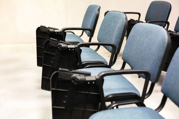 Empty university lecture hall chairs closeup no students present, empty university classroom, auditorium Lockdown, covid 19 quarantine, closed educational facilities, class dissmissed abstract concept