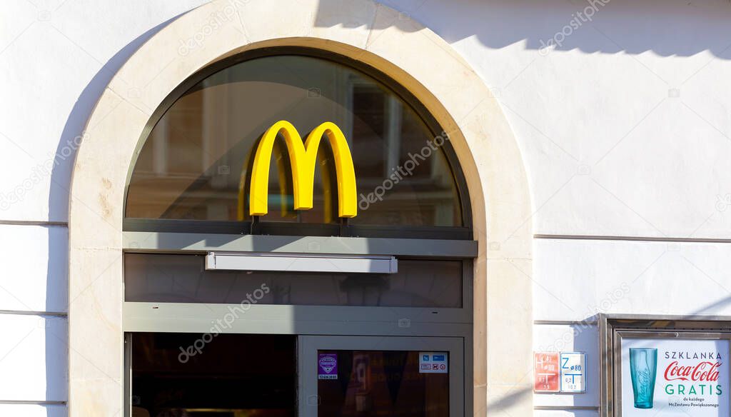 McDonalds restaurant signboard, brand symbol, logo closeup, frontal shot, building facade McDonald's fast food restaurant, exterior, Krakow, Florianska