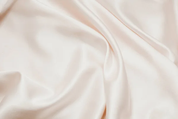 Çıplak ipek dokusu. Saten narin pudralı parlak kaplama, tasarımcılar için güzel bir zemin.