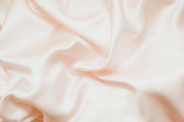 Pudralı pembe ipek dokusu, saten. Parlak kumaş arkaplanı.