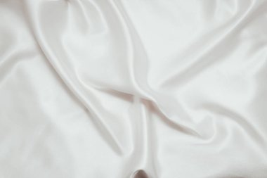 Beyaz ipek kumaş, saten. Parlak kumaş arkaplanı.