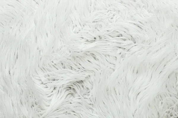White fur artificial texture. Soft and delicate background for designers.