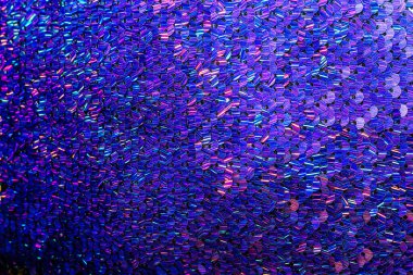 Mavi pulların parlak dokusu. Süslü elbiseler için kumaş.