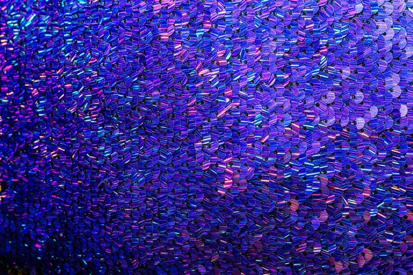 Mavi pulların parlak dokusu. Süslü elbiseler için kumaş.