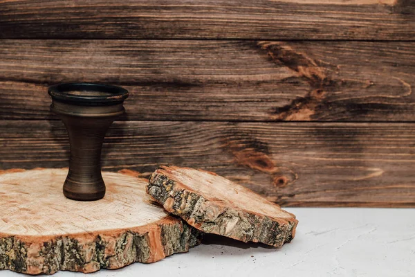 stock image Clay hookah bowl stands on wooden background.