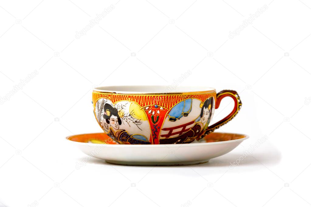 Antique Japanese Porcelain Tea Pair Cup And Saucer In The Style Of Moriage Isolated On White Background. Meiji Period.