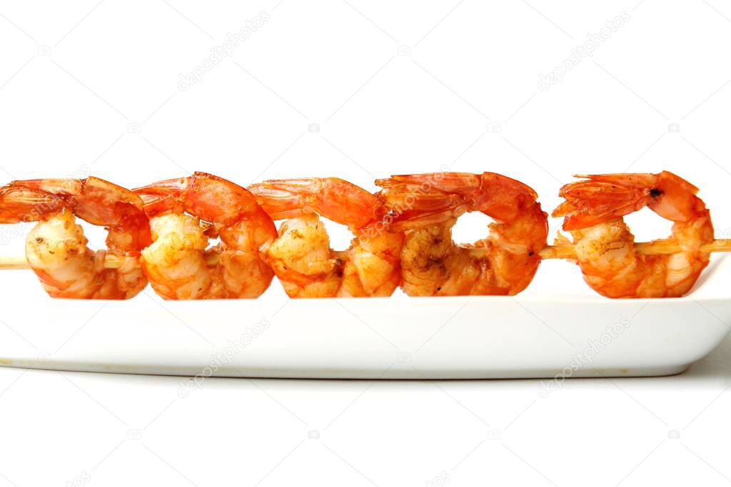 Grilled Srimps On Skewer On Plate Isolated On White Background.