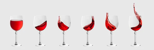 ชุดแก้วไวน์ที่มีสาดไวน์แยกจากสีเทาอ่อน — ภาพถ่ายสต็อก