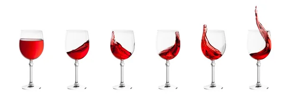 ชุดแก้วไวน์ที่มีกระเด็นของไวน์แยกกันบนหลังสีขาว — ภาพถ่ายสต็อก