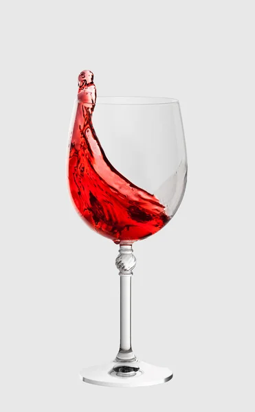 Wine glass with splash of wine isolated on light grey background — Stock Photo, Image