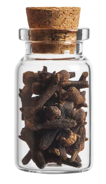 Kryddnejlika krydda i en liten flaska isolerad på vit bakgrund — Stockfoto
