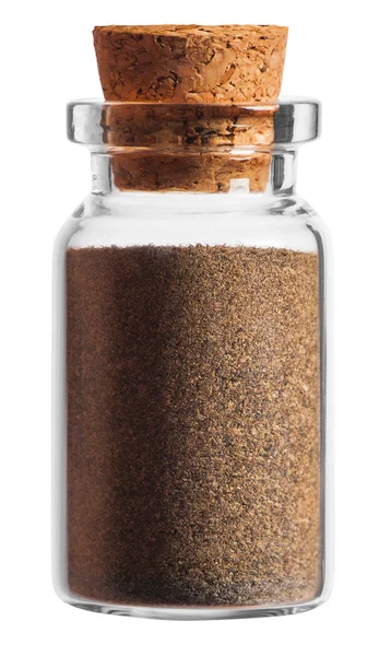 Ground black pepper spice in a little bottle isolated on white b — Stock Photo, Image