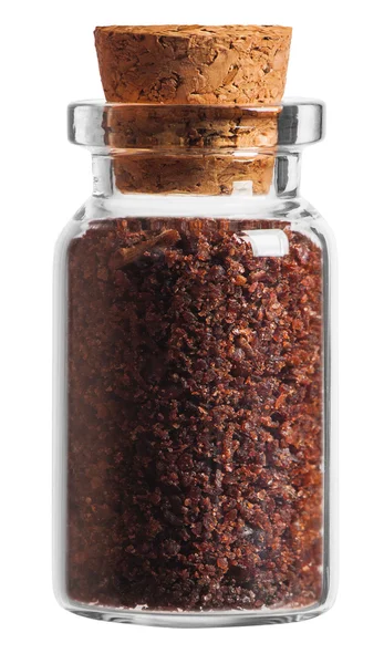 Sumac spice in a little bottle isolated on white background — Stock Photo, Image