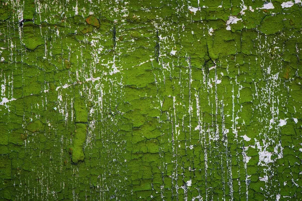 Green cracked paint on white wall — Stock Photo, Image