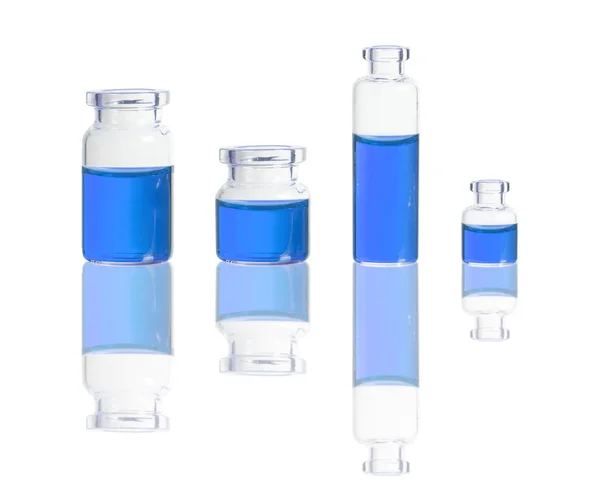 Blue liquid in bottles — Stock Photo, Image