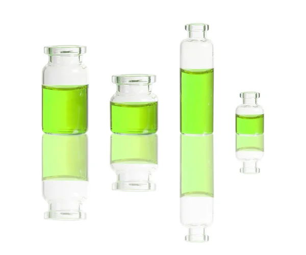 Green liquid in bottles — Stock Photo, Image