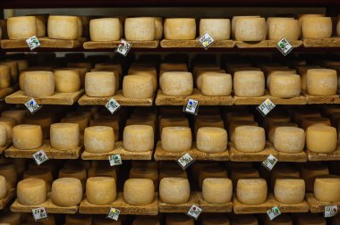 wheels of cheese in a maturing storehouse clipart