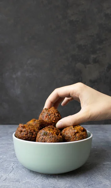 Female Hand Takes Falafel Bowl Gray Surface Copyspace Falafel — Stock Photo, Image