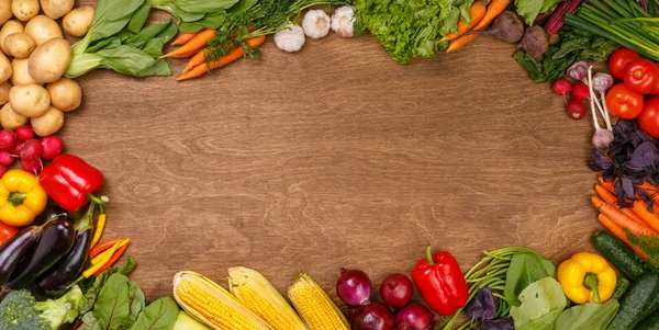 Grönsaker på trä textur bakgrund — Stockfoto