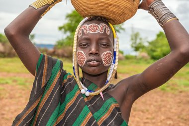 Young boy from the african tribe Mursi, Ethiopia clipart