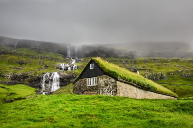 Historic stone house in Faroe Islands clipart