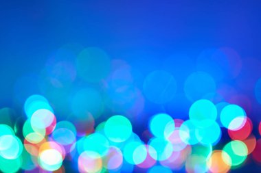 Bokeh soyut dokusu. Renkli. Odaklanmamış arka plan. Bulanık parlak ışık. Dairesel noktalar.