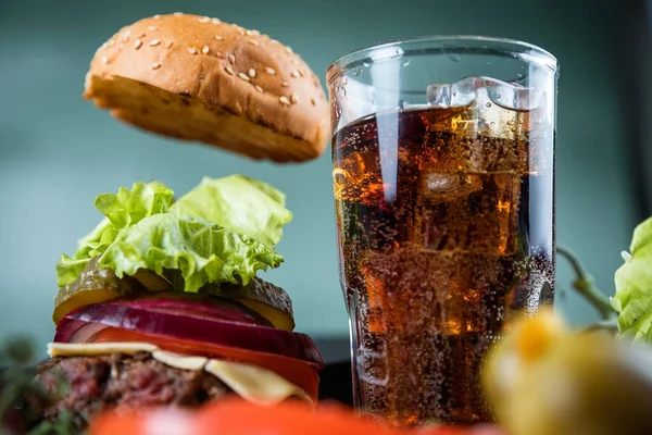 Delicious juicy Burger and carbonated drink