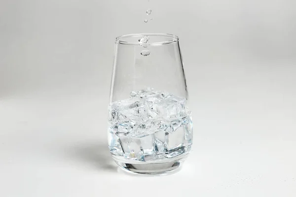 Glass of mineral carbonated water with ice