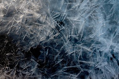 Soyut olarak kara buz yüzeyini çatlattı. Doku arkaplanı.