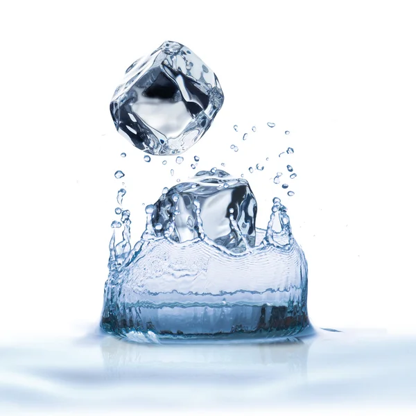 Ice cubes dropped into water — Stock Photo, Image