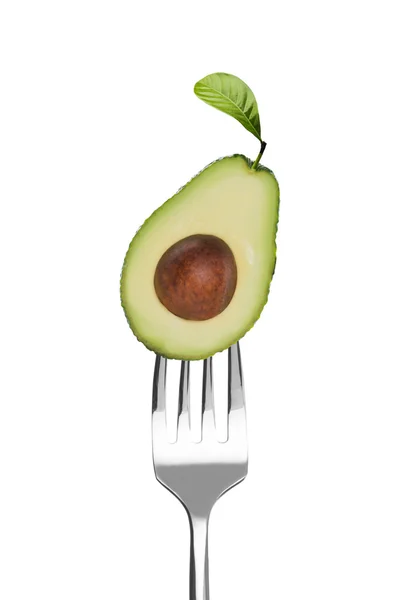 Färsk avokado på en gaffel — Stockfoto