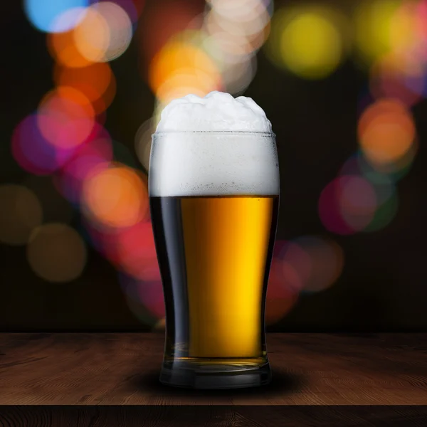 Glass of beer with bar scene — Stock Photo, Image