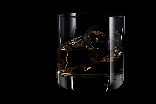 Whiskey in glass with ice cubes — Stock Photo, Image