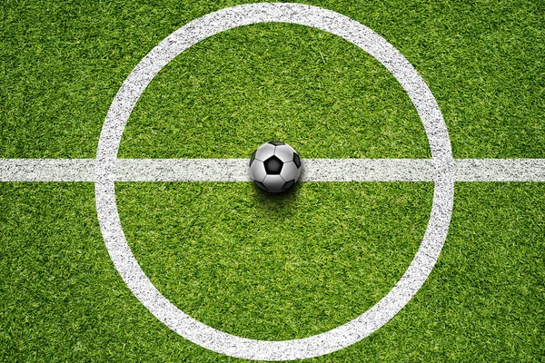 Bola de futebol no campo de grama — Fotografia de Stock