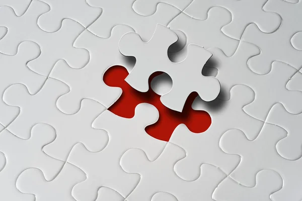 Missing jigsaw puzzle piece with light glow — Stock Photo, Image