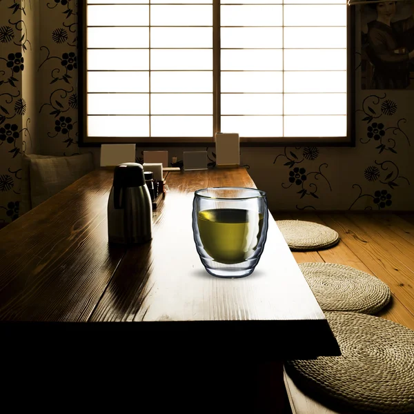 Glass of Green Tea on wood table