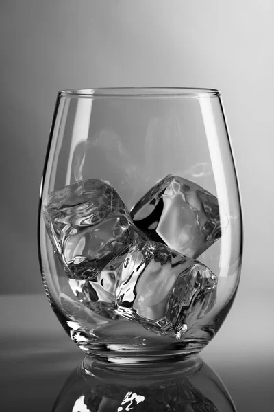 Empty glass with ice cubes — Stock Photo, Image