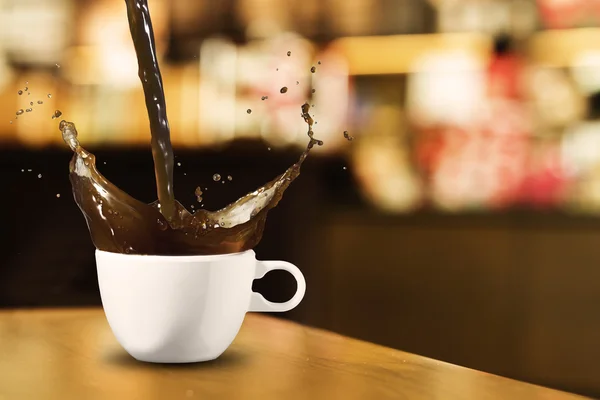 Salpicadura de café en la cafetería — Foto de Stock