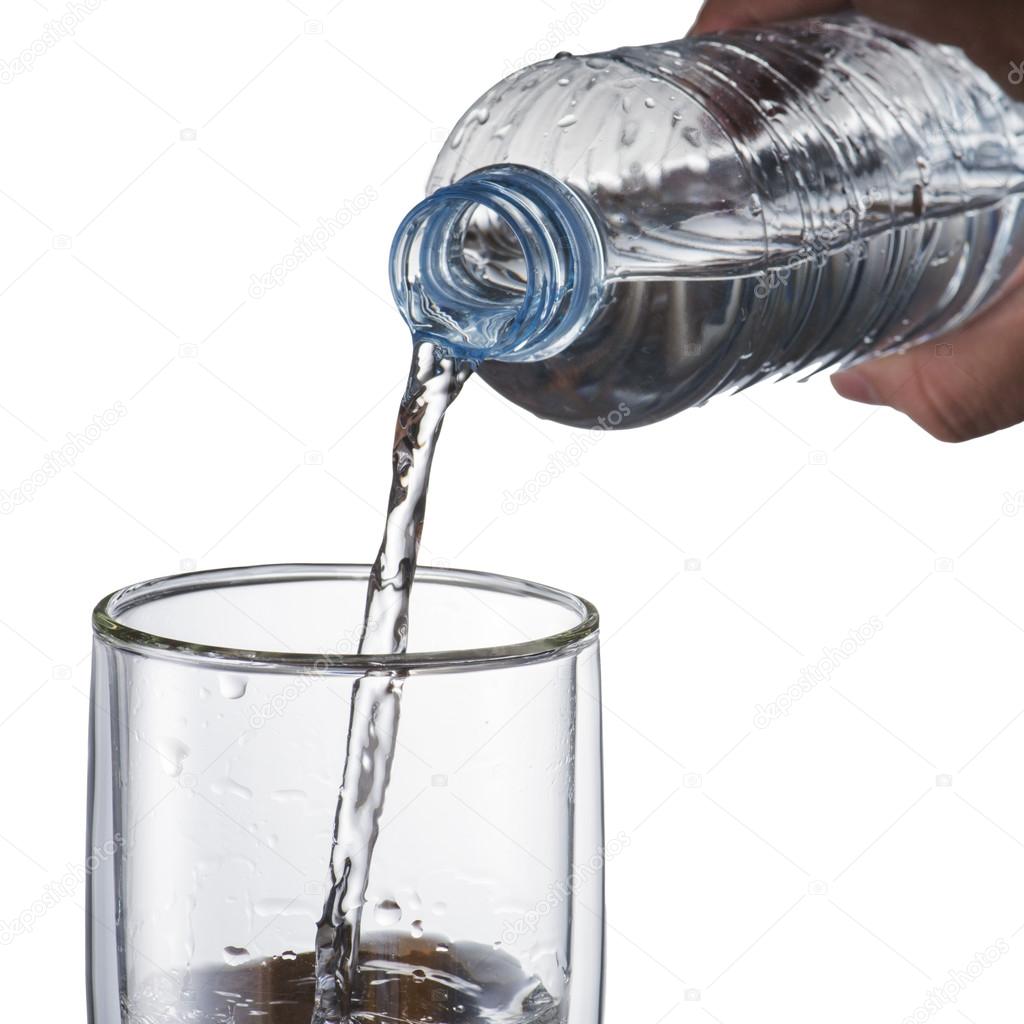 Hand Pour Water from Water Bottle To Glass