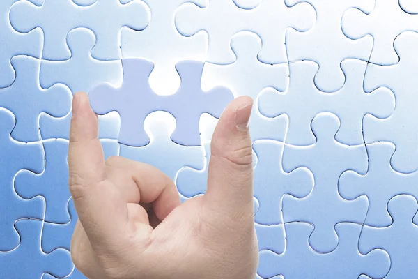 Hand holding Missing jigsaw puzzle piece — Stock Photo, Image