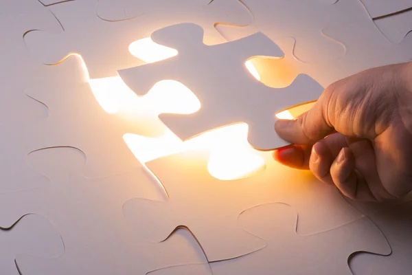 Hand holding Missing jigsaw puzzle piece — Stock Photo, Image